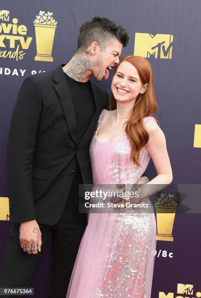 Actors Travis Mills and Madelaine Petsch attend the 2018 MTV Movie And TV Awards at Barker Hangar on June 16, 2018 in Santa Monica, California.