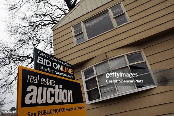 Sign is displayed in front of a foreclosed home on March 12, 2010 in Bridgeport, Connecticut. A new report by RealtyTrac Inc. Announced that the...