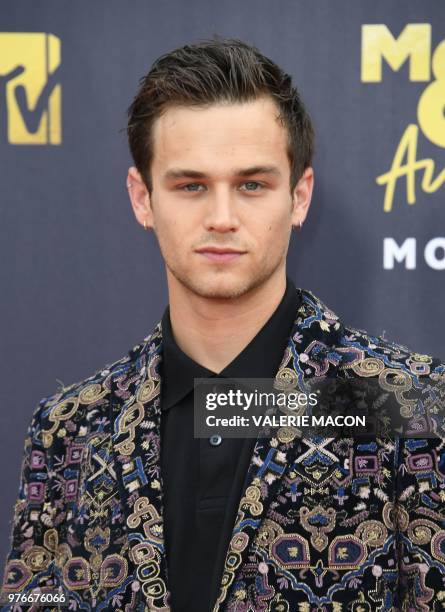 Actor Brandon Flynn attends the 2018 MTV Movie & TV awards, at the Barker Hangar in Santa Monica on June 16, 2018. - This year's show is not live. It...