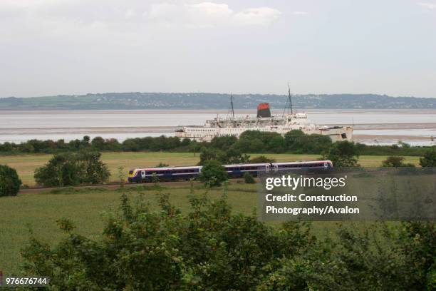 First North Western Class 175 runs by the estuary of the River Dee at Mostyn on the North Wales coast with a service to Crewe. September 2004.