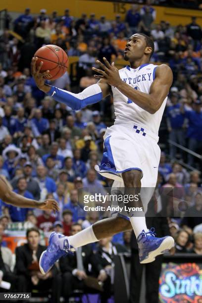 John Wall of the Kentucky Wildcats drives for a shot attempt against the Alabama Crimson Tide during the quarterfinals of the SEC Men's Basketball...