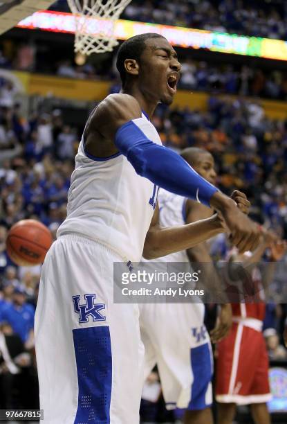 John Wall of the Kentucky Wildcats reacts in the first half against the Alabama Crimson Tide during the quarterfinals of the SEC Men's Basketball...