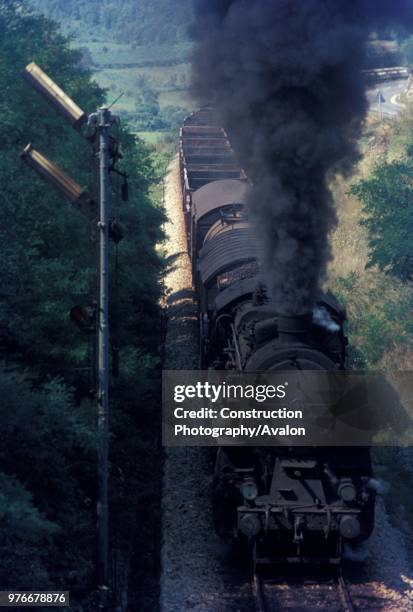 Former Prussian G12 Class 3 cylinder 2-10-0 classified 36 by Yugoslav Railways - storms the gradient from Prvacina to Stanjel on the line between...