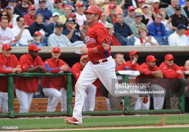Catcher Brian Schneider of the Philadelphia Phillies scores the first run against the Detroit Tigers March 11, 2010 at the Bright House Field in...