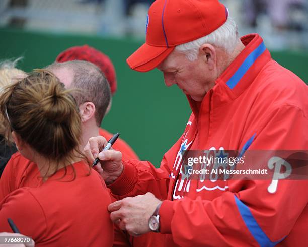 Manager Charlie Manuel of the Philadelphia Phillies signs an autograph before play against the Detroit Tigers March 11, 2010 at the Bright House...