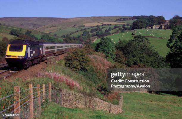 Midland Mainline Rio service is seen here traveling along the picturesque Hope Valley line in the Peak District national park shortly after passing...