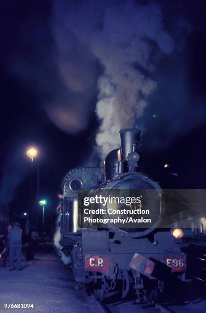 Night train from Sernada - Aveiro behind Portuguese Railway's meter gauge Orensteinand Koppel 2-6-0T No. E96 in September 1970.