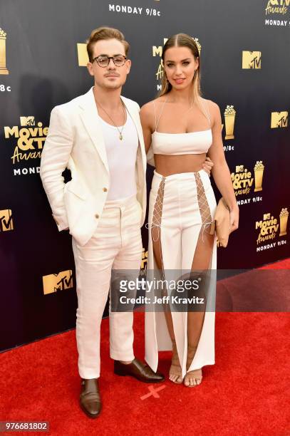 Actor Dacre Montgomery and model Liv Pollock attend the 2018 MTV Movie And TV Awards at Barker Hangar on June 16, 2018 in Santa Monica, California.