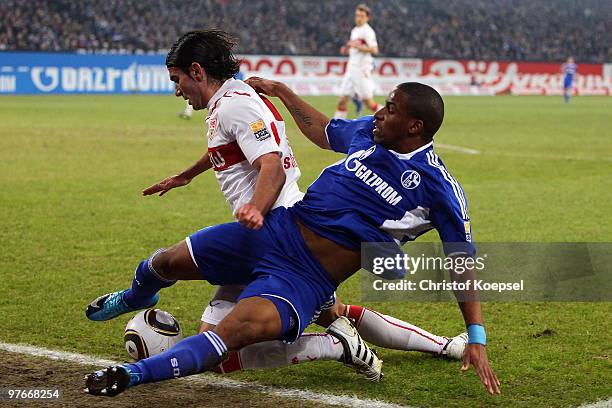 Serdar Tasci of Stuttgart challenges Jefferson Farfan of Schalke during the Bundesliga match between FC Schalke 04 and VfB Stuttgart at the Veltins...