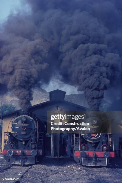 Pair of Turkish Railways Vulcan Skyliner 2-10-0s of the late 1940's boil up outside the depot at Irmak on Saturday 17th July 1976.