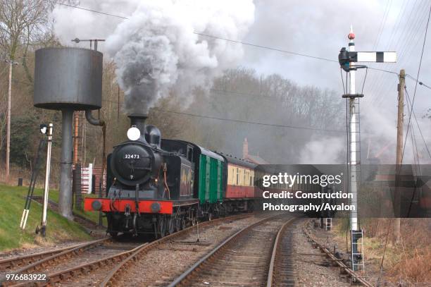 Re-creation of a local train on the preserved Severn Valley Railway by photographers is seen making a run past at Highley station. March 2005.