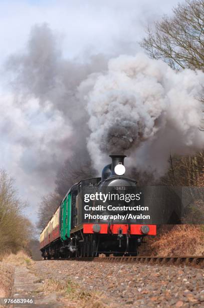 Re-creation of a local train on the preserved Severn Valley Railway by photographers is seen making a run past at Northwood Lane. March 2005.