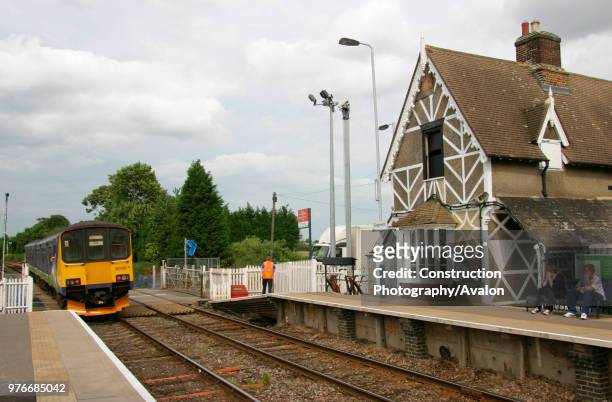 Silverlink Class 150 departs from Ridgemont station on the Bedford to Bletchley line. June 2004.