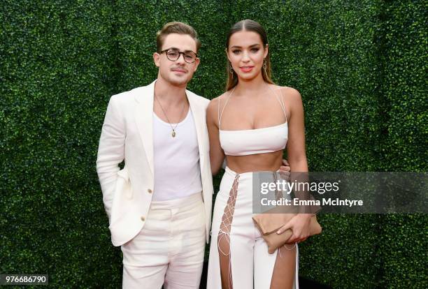 Actor Dacre Montgomery and model Liv Pollock attend the 2018 MTV Movie And TV Awards at Barker Hangar on June 16, 2018 in Santa Monica, California.