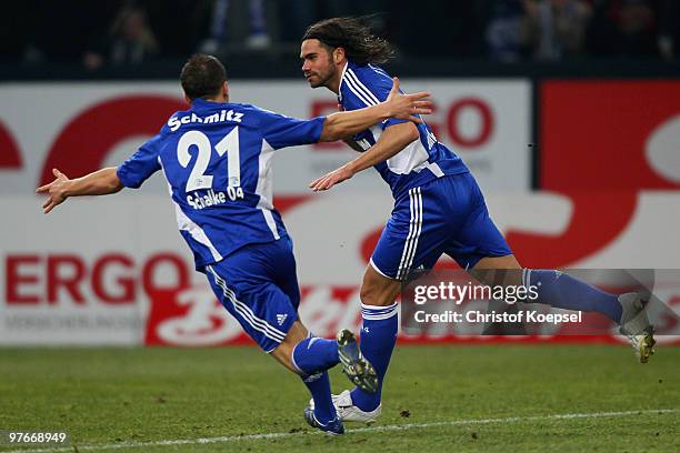 Edu of Schalke celebrates his team's first goal with team mate Lukas Schmitz of Schalke during the Bundesliga match between FC Schalke 04 and VfB...