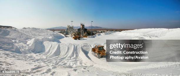 Track loaders arranging salt hills in the Salar of Atacama.