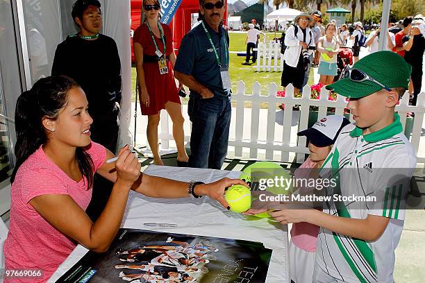 Ana Ivanovic of Serbia signs autographs and poses for photographs during the BNP Paribas Open on March 11, 2010 in Indian Wells, California.