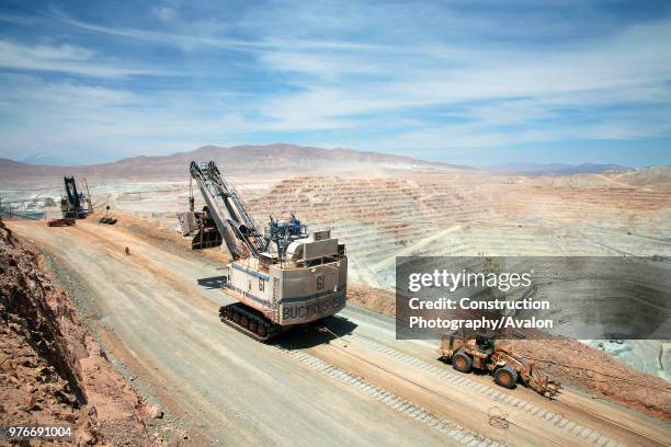 Two Electric Shovels On A Road in Copper Mine Escondida, Chile.