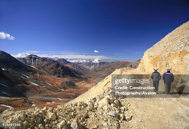 Two Miners Walk Through The Exploration Road In The Andes, At 4000 m High They have The Best View To Argentina.