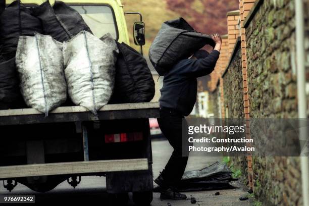 Coalman delivering concessionary coal to a retired miner at Llanhilleth South Wales UK.