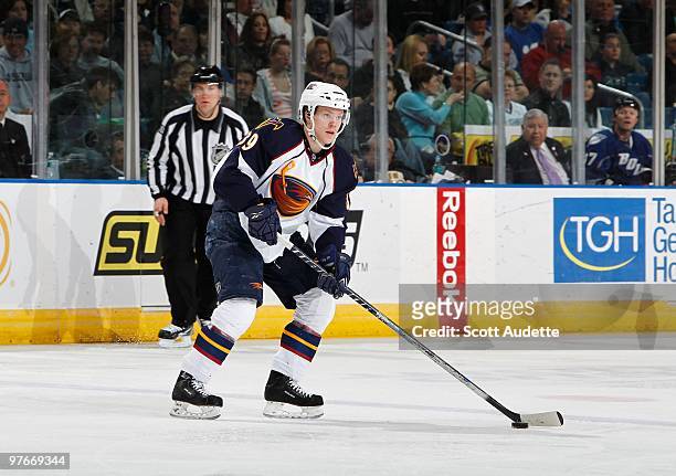 Tobias Enstrom of the Atlanta Thrashers passes the puck against the Tampa Bay Lightning at the St. Pete Times Forum on March 6, 2010 in Tampa,...