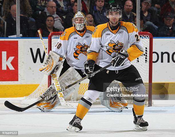 Peter Stevens of the Sarnia Sting defends in front of teammate Shayne Campbell in a game against the London Knights on March 10, 2010 at the John...
