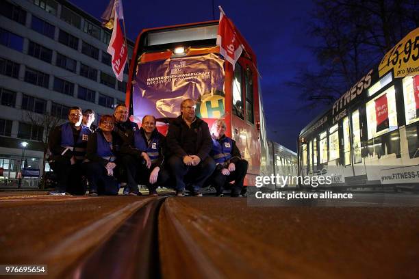 April 2018, Germany, Cologne: Unionists strike outside a train depot. Labour union Verdi called for large-scale public service strikes. Photo: Oliver...