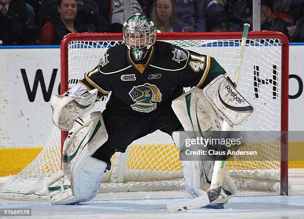Michael Hutchinson of the London Knights watches for a shot in a game against the Sarnia Sting on March 10, 2010 at the John Labatt Centre in London,...