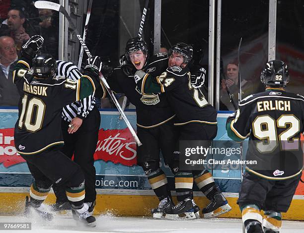 Scott Harrington of the London Knights touches off a celebration with his teammates after scoring his 1st OHL goal in a game against the Sarnia Sting...