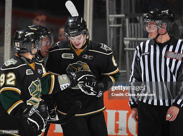 Scott Harrington of the London Knights gets the puck from teammate Chris DeSousa after scoring his 1st OHL goal in a game against the Sarnia Sting on...