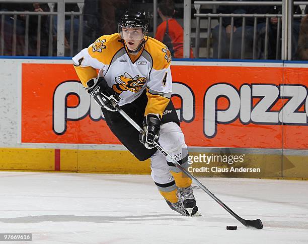 Ron Soucie of the Sarnia Sting skates up ice with the puck in a game against the London Knights on March 10, 2010 at the John Labatt Centre in...