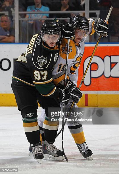 Jared Knight of the London Knights is tied up by Craig Hottot of the Sarnia Sting in a game on March 10, 2010 at the John Labatt Centre in London,...