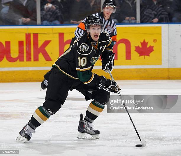 Steven Tarasuk of the London Knights skates with the puck in a game against the Sarnia Sting on March 10, 2010 at the John Labatt Centre in London,...