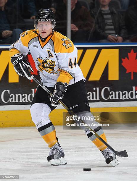 Kale Kerbashian of the Sarnia Sting skates with the puck in a game against the London Knights on March 10, 2010 at the John Labatt Centre in London,...