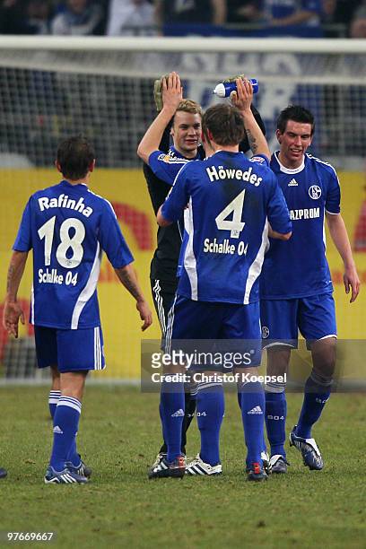 Rafinha, Manuel Neuer, Benedikt Hoewedes and Christoph Moritz of Schalke celebrate the 2:1 victory after the Bundesliga match between FC Schalke 04...