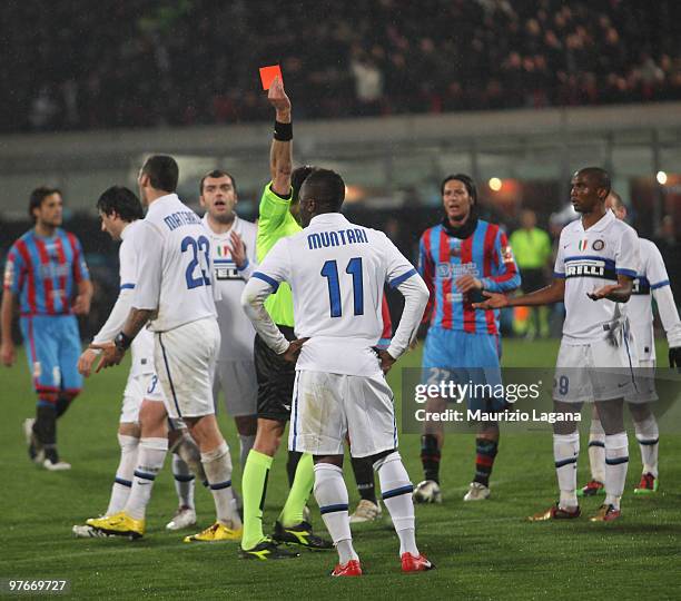 The referee Luca Valeri shows a red card to Sulley Muntari of FC Internazionale Milano during the Serie A match between Catania Calcio and FC...