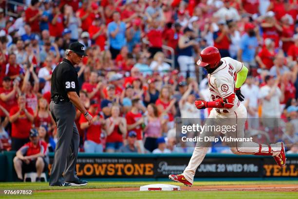 Tommy Pham of the St. Louis Cardinals rounds third base after hitting a two-run home run against the Chicago Cubs in the first inning at Busch...