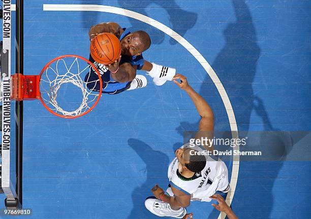 DeShawn Stevenson of the Dallas Mavericks takes the ball to the basket against Ryan Hollins of the Minnesota Timberwolves during the game at Target...