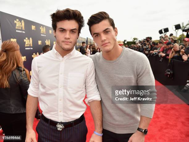 Comedians Ethan Dolan and Grayson Dolan attend the 2018 MTV Movie And TV Awards at Barker Hangar on June 16, 2018 in Santa Monica, California.