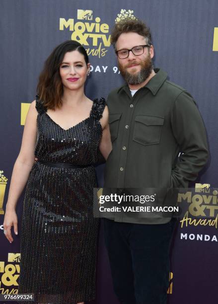 Actor Seth Rogen and his wife US actress and writer Lauren Miller attend the 2018 MTV Movie & TV awards, at the Barker Hangar in Santa Monica on June...