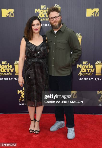 Actor Seth Rogen and his wife US actress and writer Lauren Miller attend the 2018 MTV Movie & TV awards, at the Barker Hangar in Santa Monica on June...