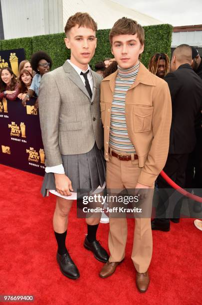 Actors Tommy Dorfman and Miles Heizer attend the 2018 MTV Movie And TV Awards at Barker Hangar on June 16, 2018 in Santa Monica, California.