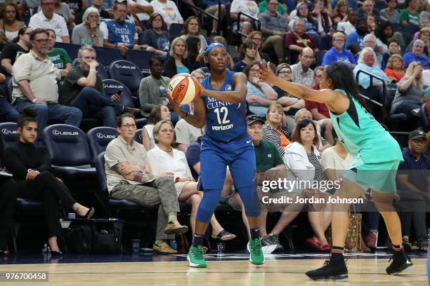 Alexis Jones of the Minnesota Lynx handles the ball against the New York Liberty on June 16, 2018 at Target Center in Minneapolis, Minnesota. NOTE TO...