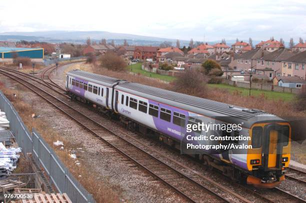 Class 156 Sprinter DMU trainset, in new Northern Trains lilac livery, approaches Morecambe with a Lancaster - Heysham Port service. March 2005.