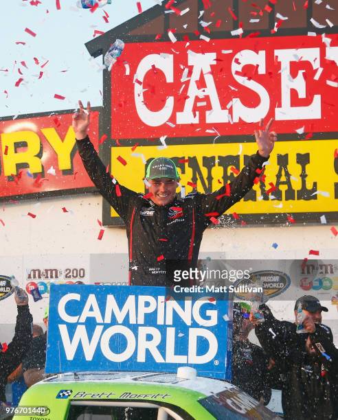 Brett Moffitt, driver of the Destiny Homes Toyota, celebrates in Victory Lane after winning the NASCAR Camping World Truck Series M&M's 200 presented...