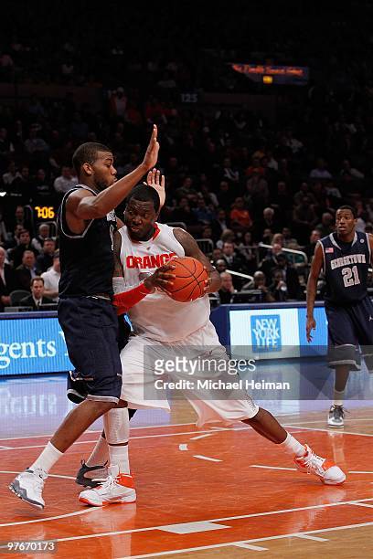 Greg Monroe of the Georgetown Hoyas defends against Rick Jackson of the Syracuse Orange during the quarterfinal of the 2010 NCAA Big East Tournament...