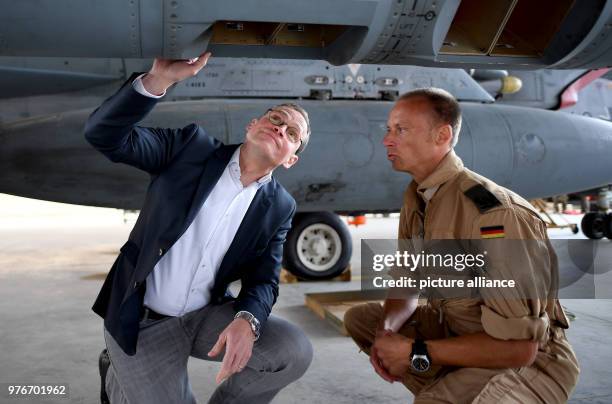 Dpatop - Governing Mayor of Berlin and President of the Bundesrat Michael Mueller and pilot Stefan G. Inspect a German Panavia Tornado jet fighter...