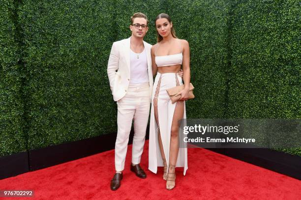 Actor Dacre Montgomery and model Liv Pollock attend the 2018 MTV Movie And TV Awards at Barker Hangar on June 16, 2018 in Santa Monica, California.