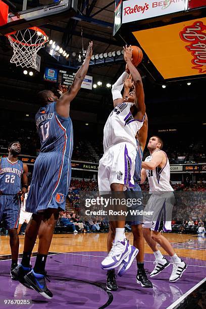 Jason Thompson of the Sacramento Kings shoots over Nazr Mohammed of the Charlotte Bobcats during the game on January 30, 2010 at Arco Arena in...