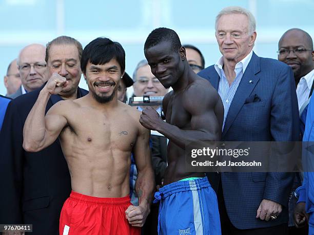 Manny Pacquiao of the Philippines and Joshua Clottey of Ghana pose after the weigh-in for their WBO welterweight title fight outside Cowboys Stadium...